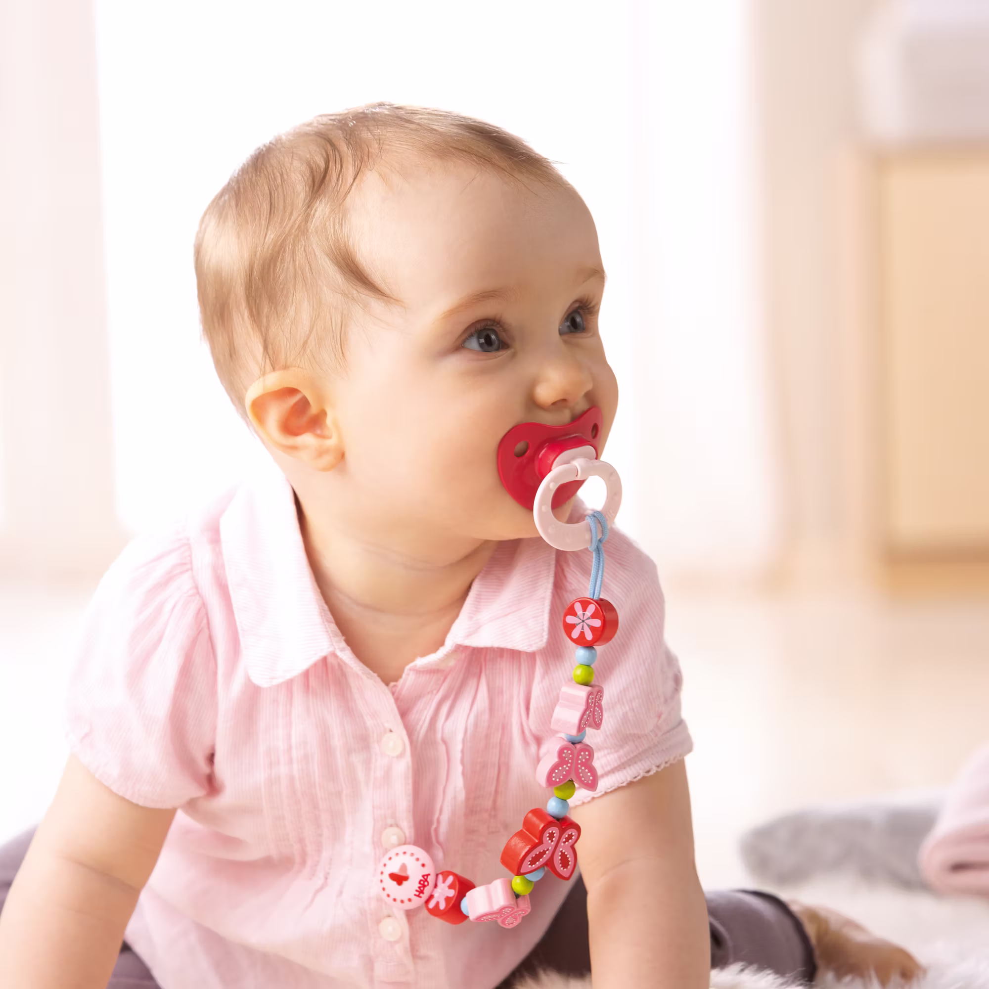 Schnullerkette Schmetterlingszauber rosa, rot - Jamouz