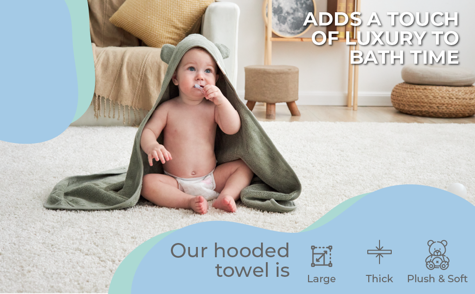 A toddler after bath in a plush, thick and moisture-wicking towel with bear ears