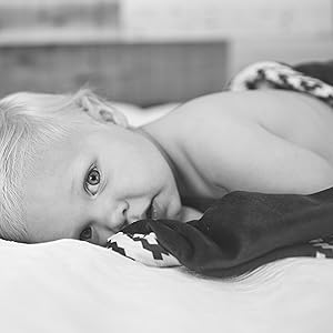 baby lying on a blanket 